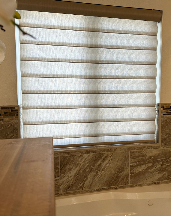 Installed Hunter Douglas blinds in bedroom